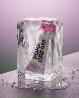 a tube of cream sitting on top of an ice block