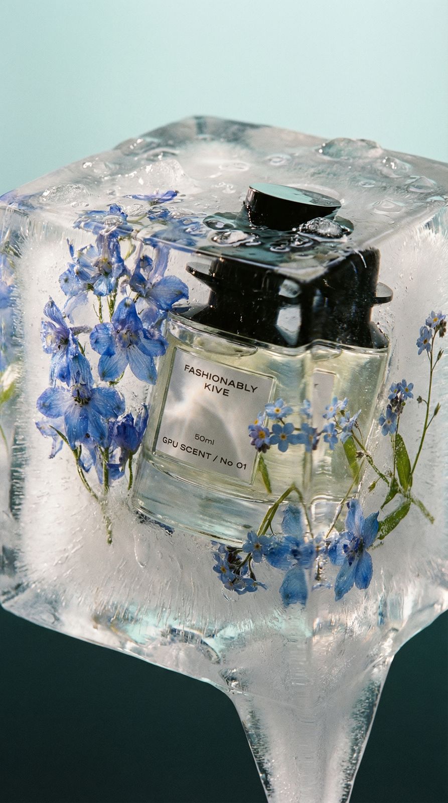 a bottle of perfume sitting on top of an ice block