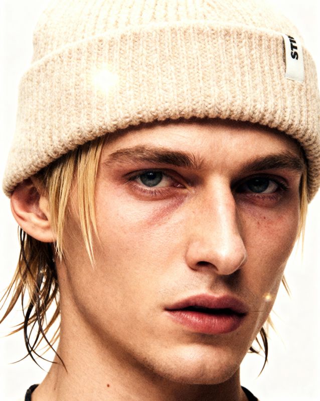 a close up of a person wearing a hat