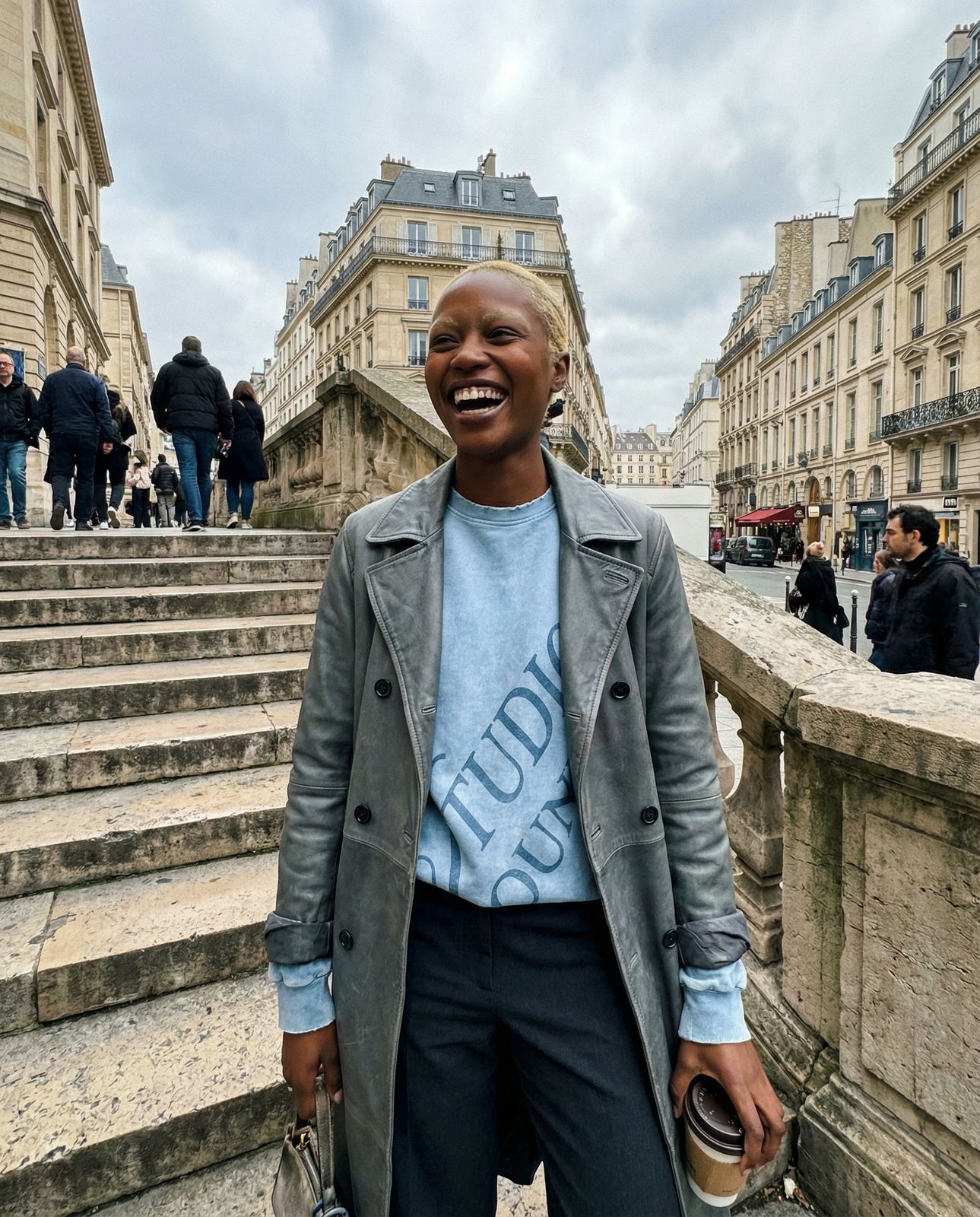 a woman standing in front of some steps