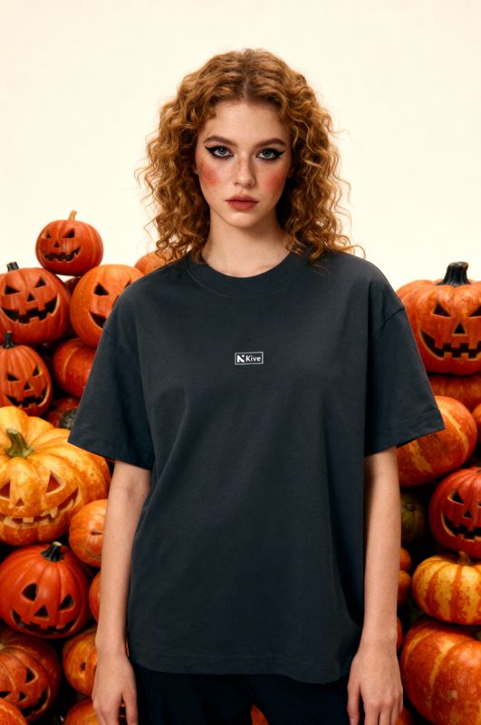 a woman standing in front of a pile of pumpkins