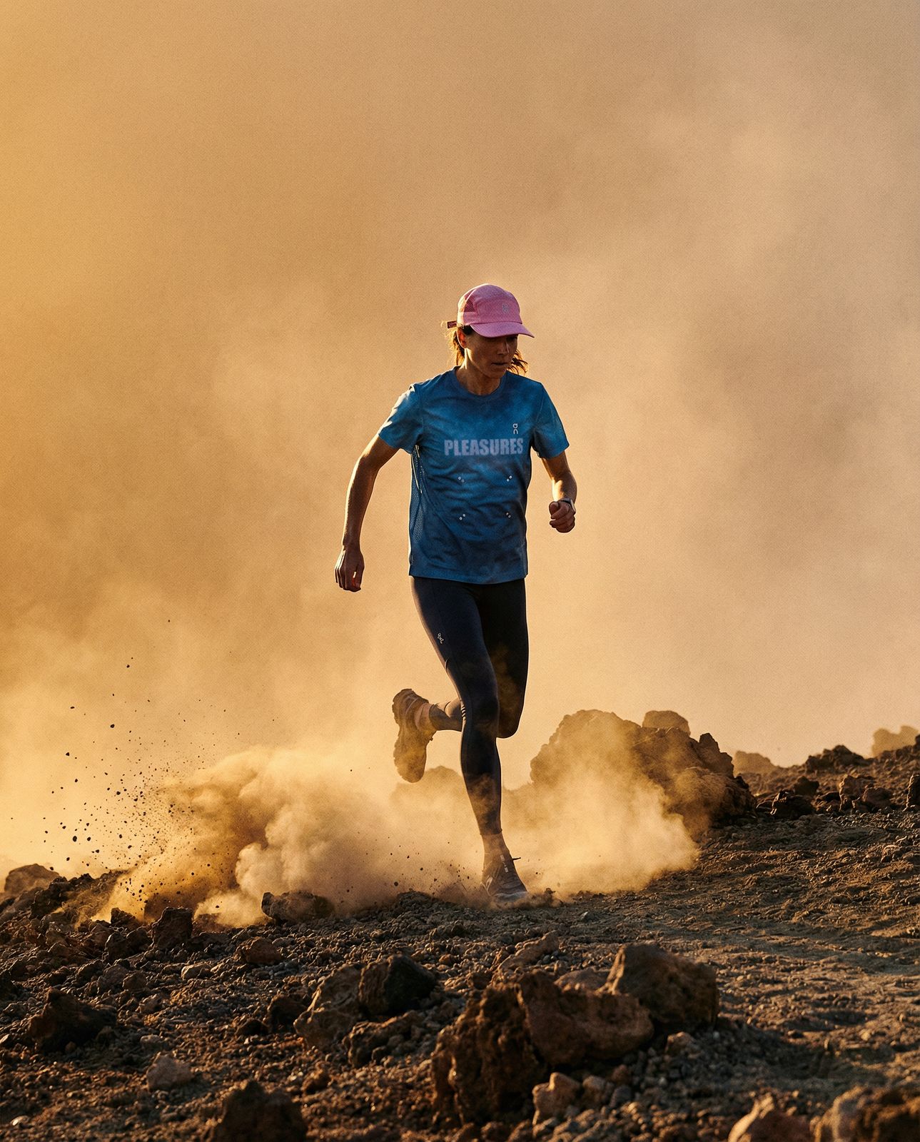 a man running on a rocky trail in the desert