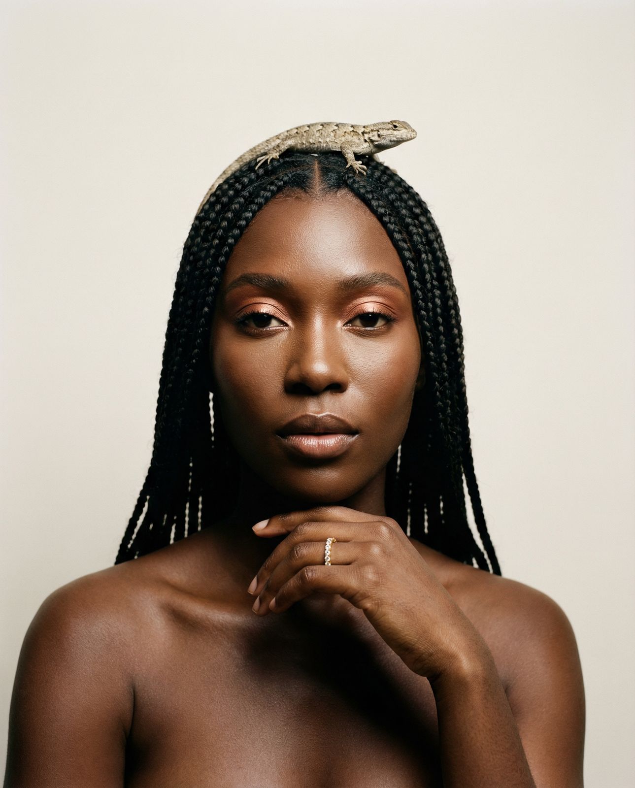 a woman with a snake on her head