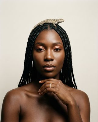 a woman with a snake on her head