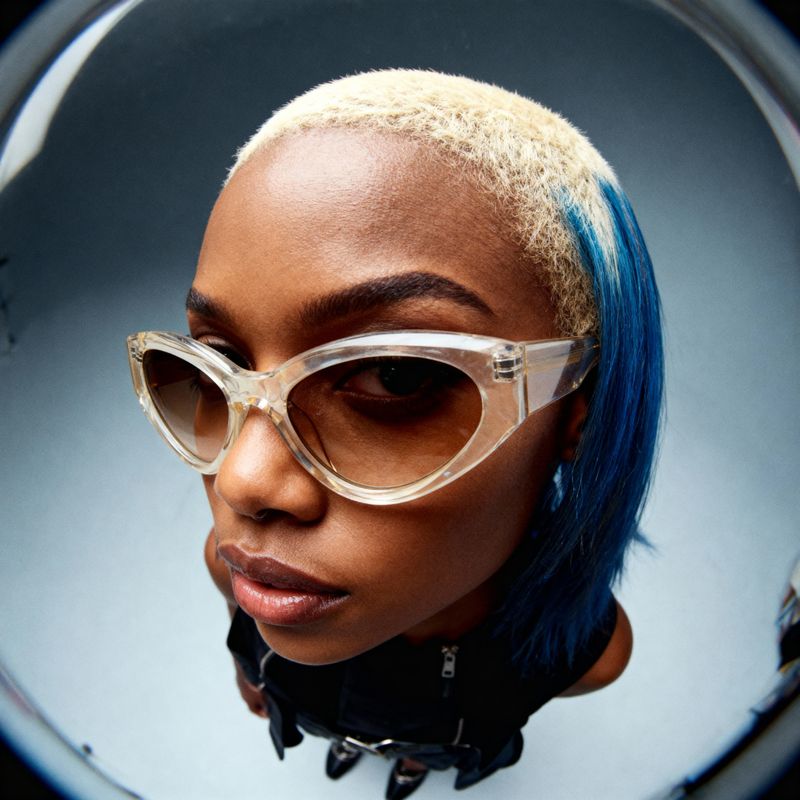 a close up of a person wearing glasses