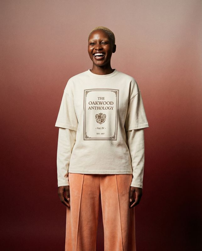 a woman standing in front of a red wall
