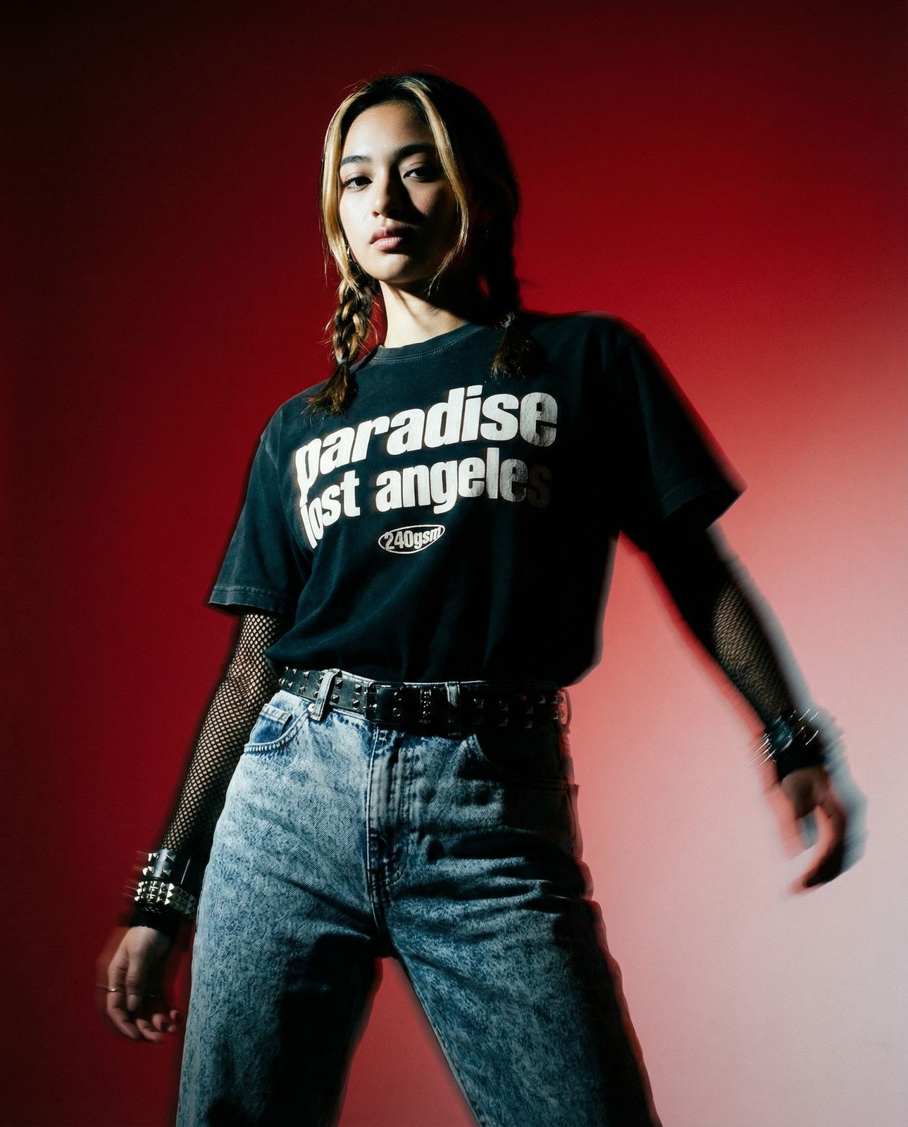 a woman in a black shirt is posing for a picture