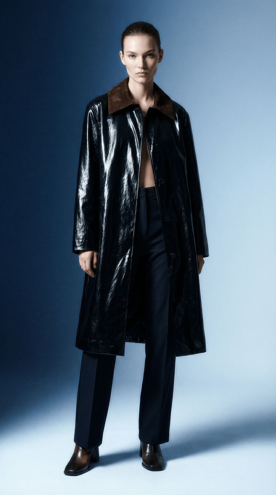 a man in a black coat and black pants