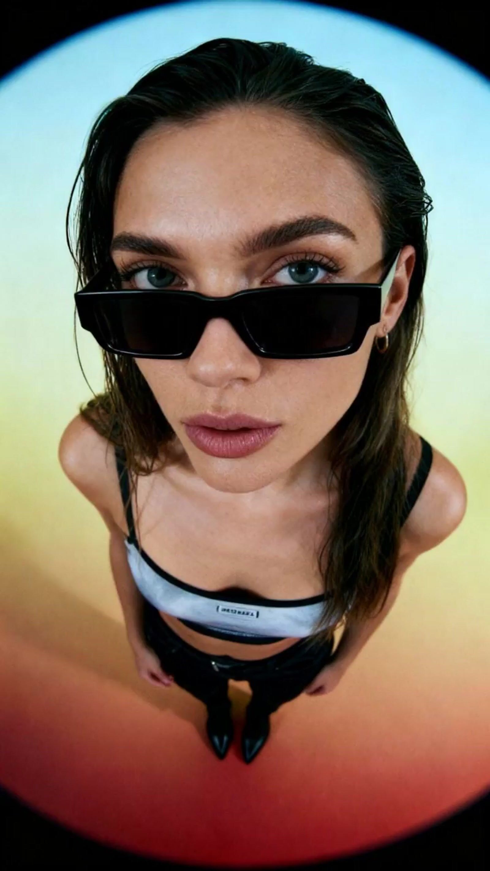 a woman wearing a helmet and sunglasses