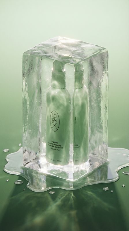 a couple of bottles of liquid sitting on top of a ice block