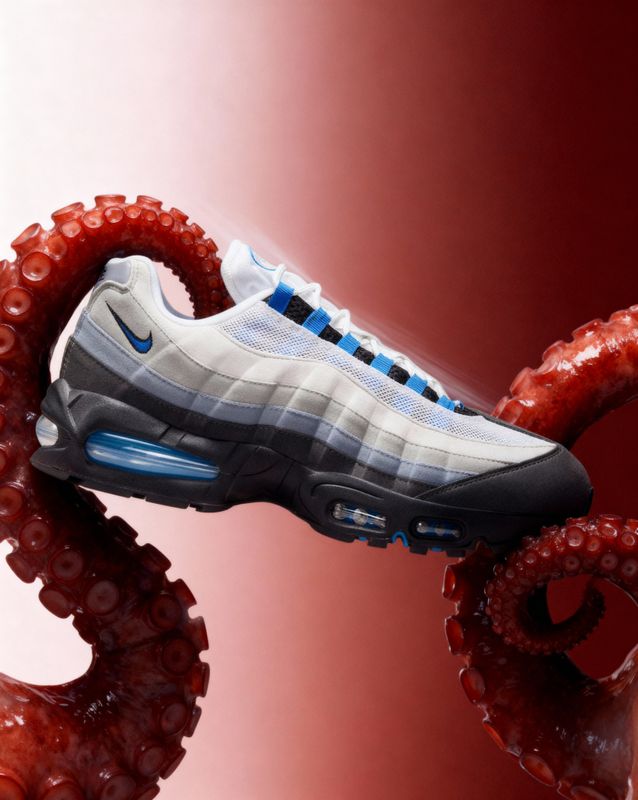 a pair of sneakers that are on top of an octopus