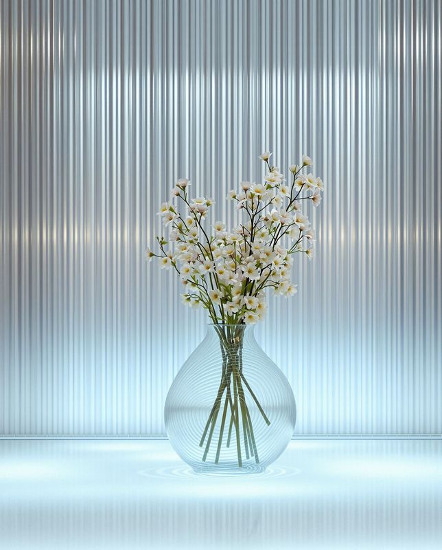 a glass vase with white flowers in it
