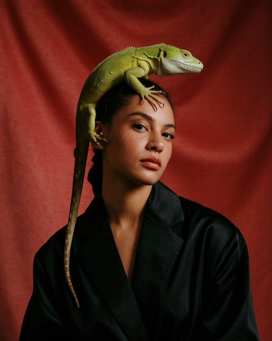 a woman with a lizard on her head