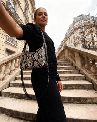 a woman taking a selfie with her cell phone