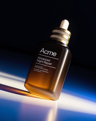 a bottle of acne advanced night repair