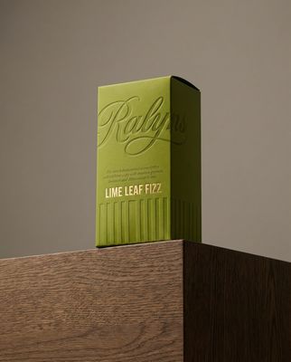 a green box sitting on top of a wooden table