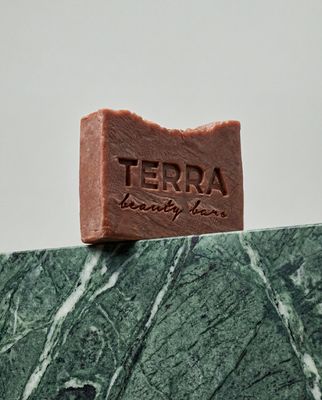 a bar of soap sitting on top of a marble slab