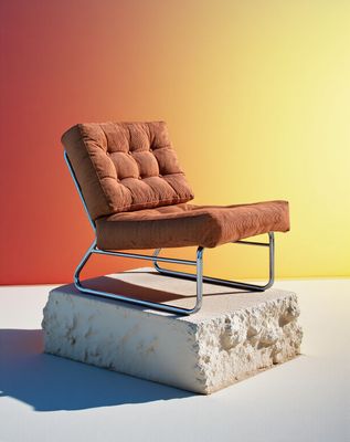a chair sitting on top of a cement block