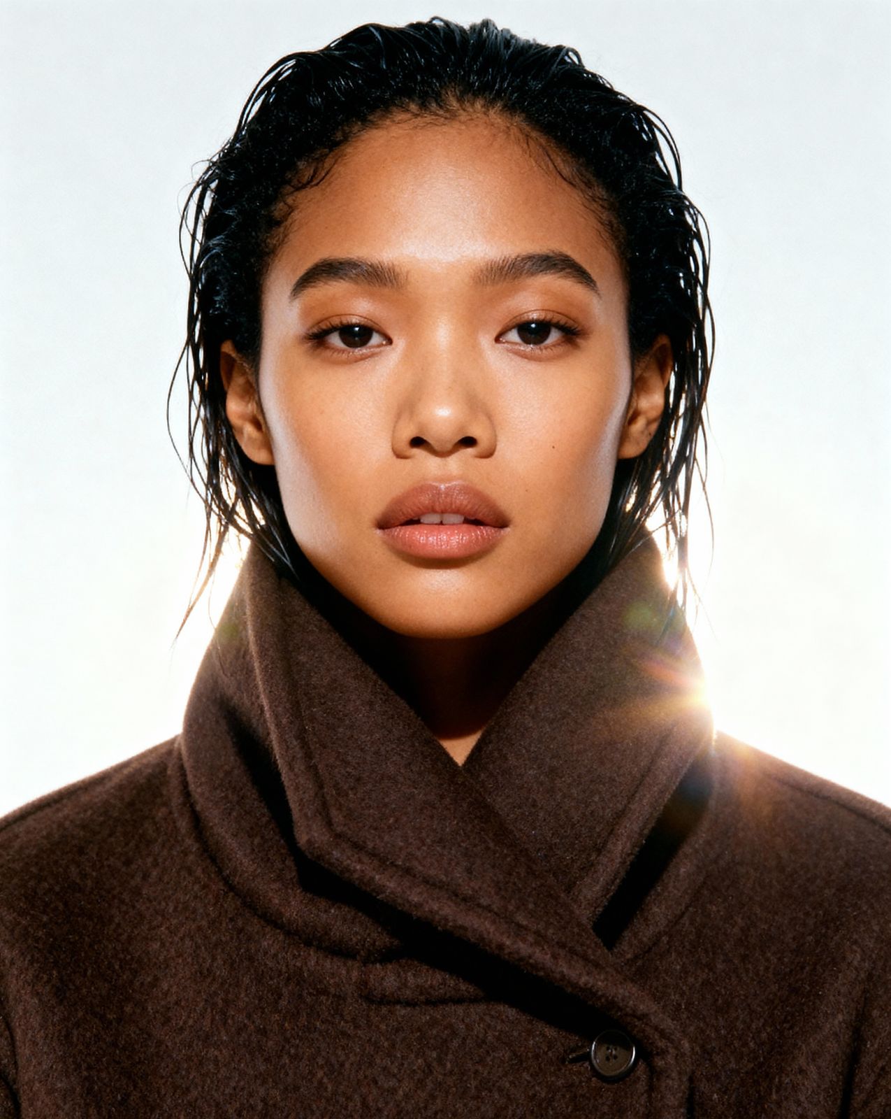 a close up of a person wearing a coat