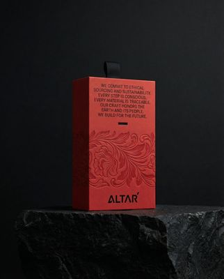 a red box sitting on top of a rock