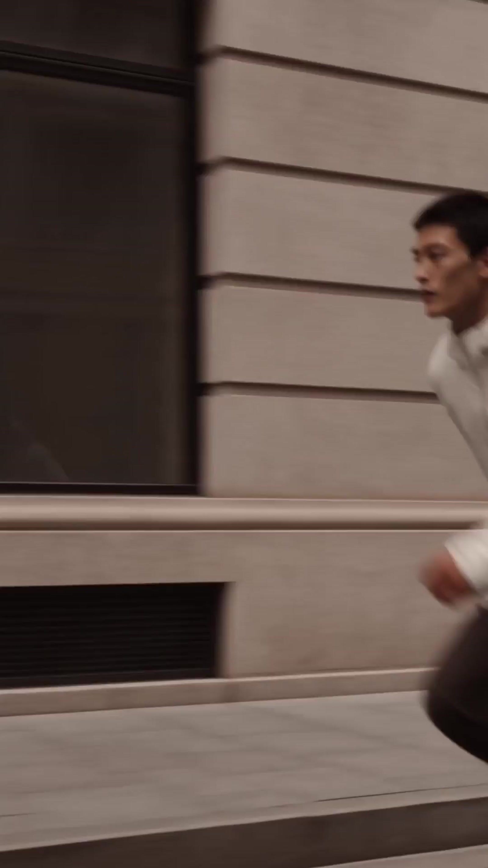 a man riding a skateboard down a street