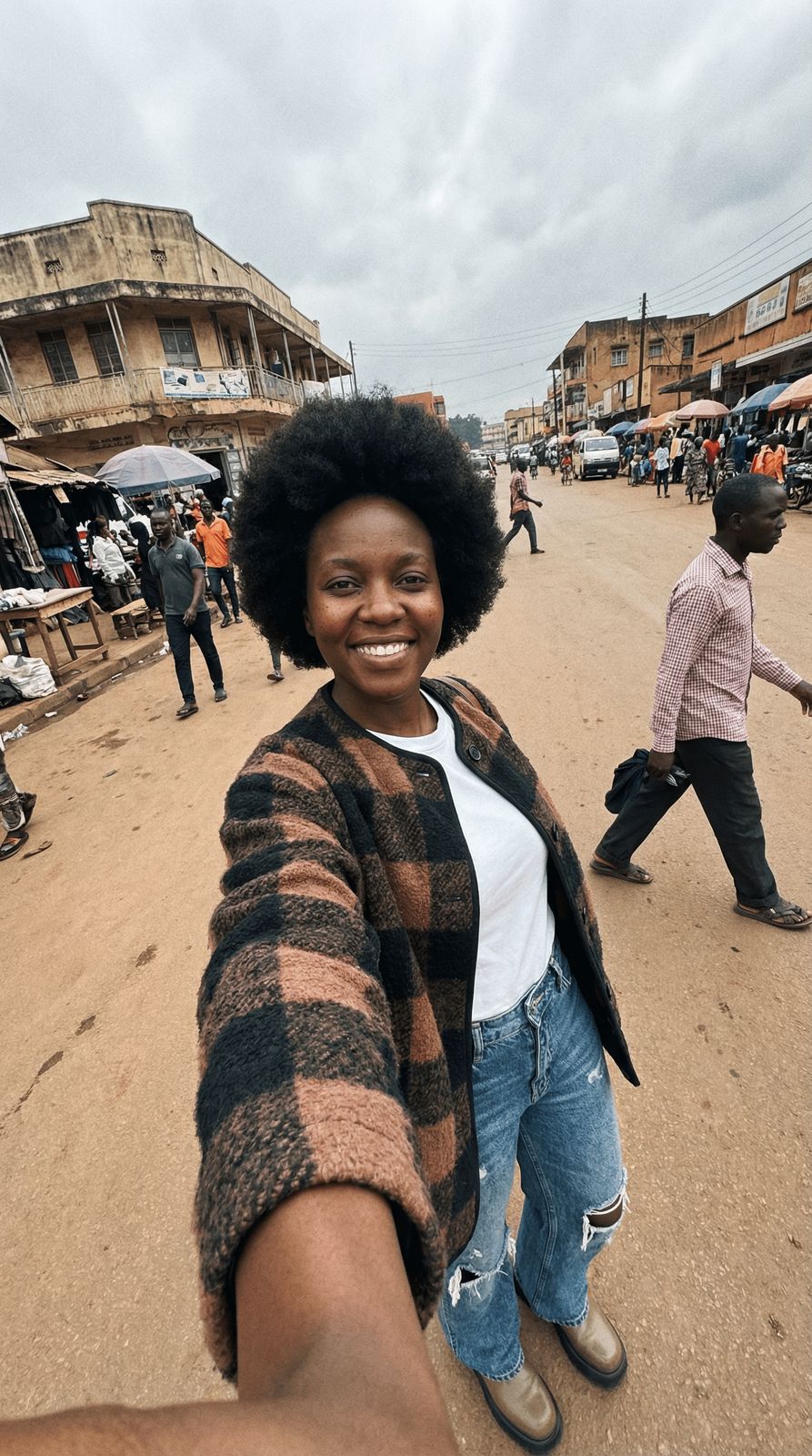a woman taking a selfie in the middle of a street