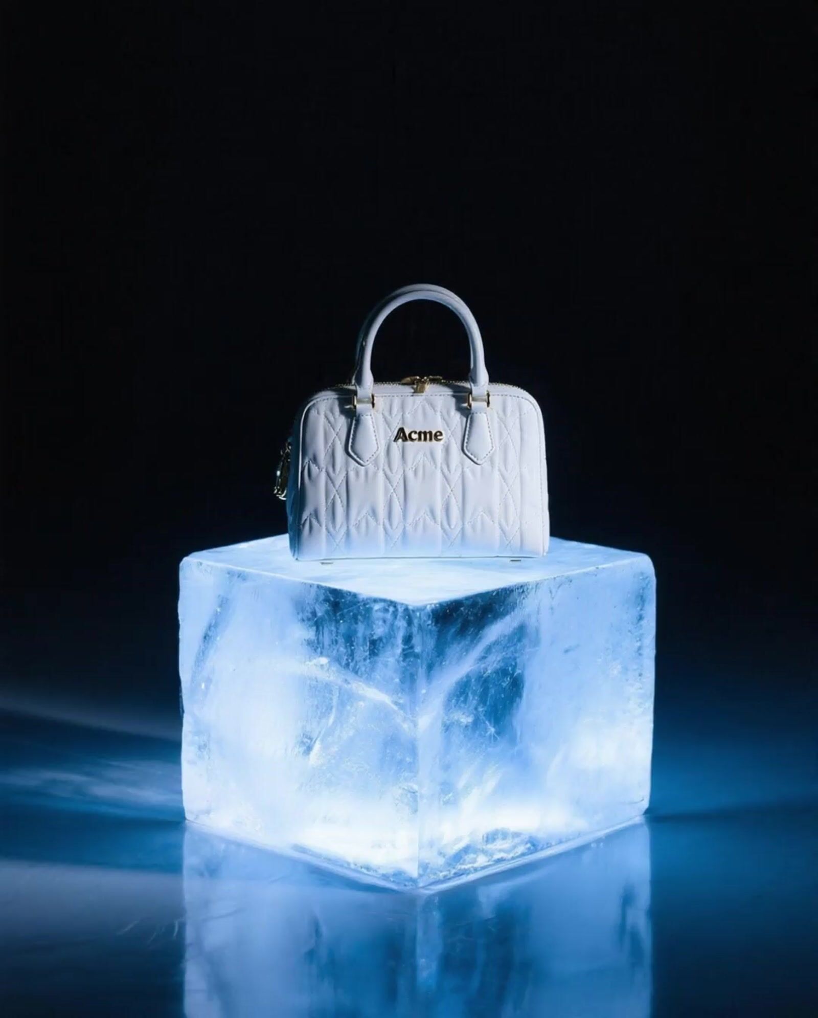 a white bag sitting on top of an ice block