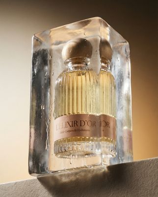 a bottle of perfume sitting on top of a shelf