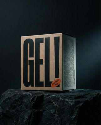 a box of gel sitting on top of a rock