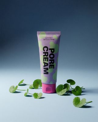 a tube of cream sitting on top of a table