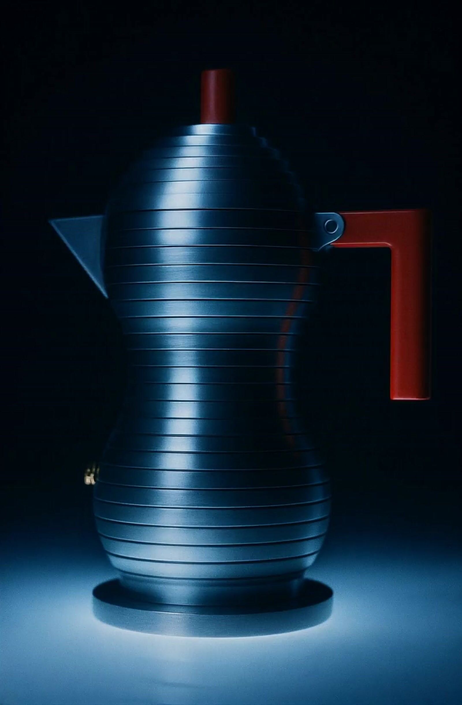 a coffee pot with a red handle on a blue background