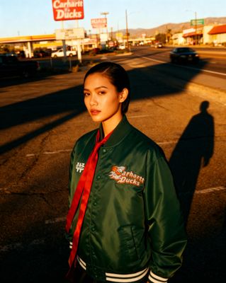 a woman standing in the middle of a street