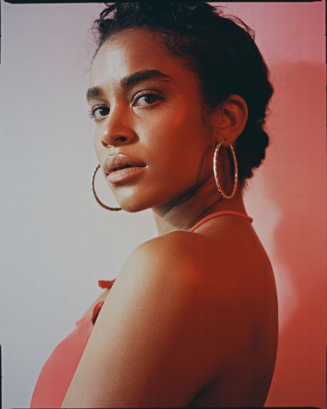 a woman with large hoop earrings on her head