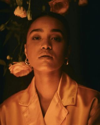 a woman with a flower in her hair