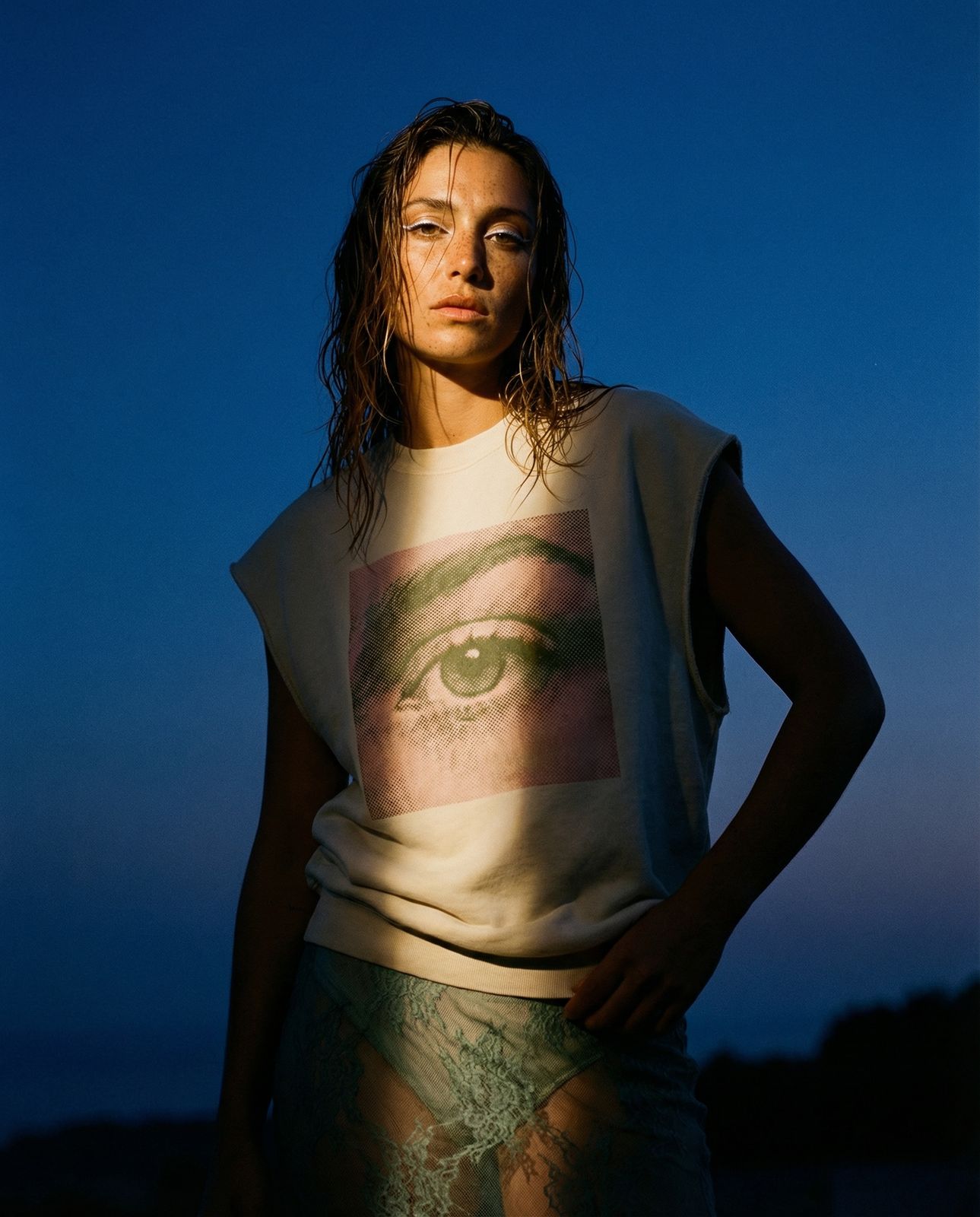 a woman with her hands on her hips