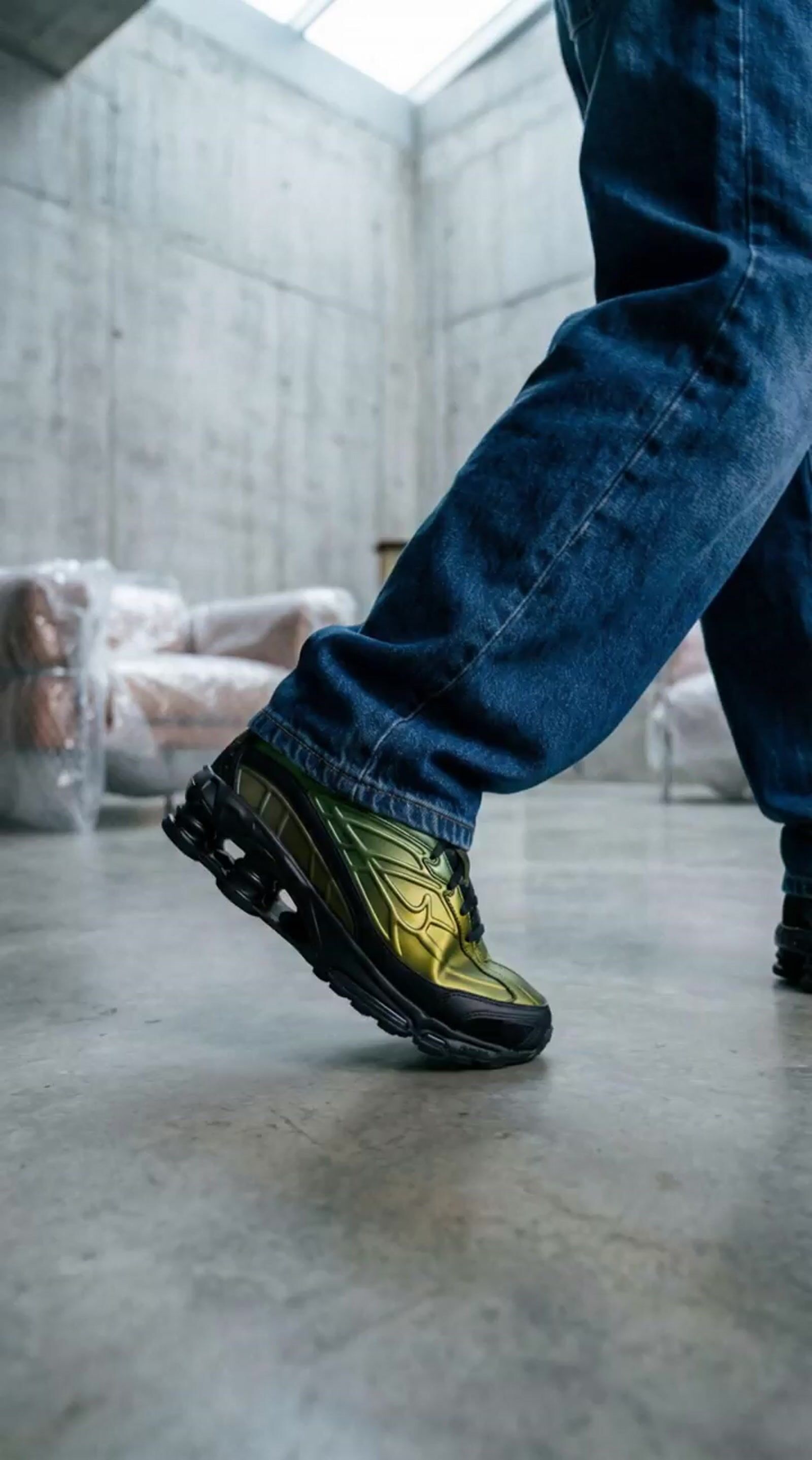 a person walking on a concrete floor in a room
