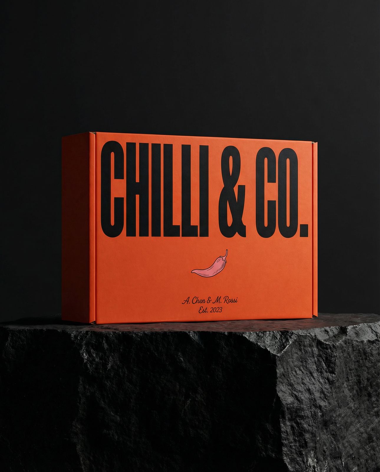 a box of chilli and co sitting on a rock