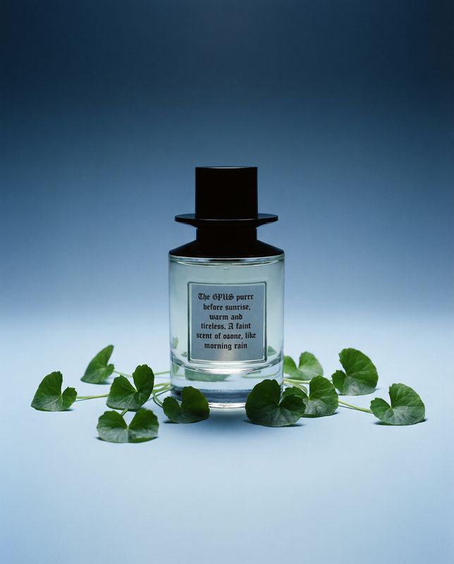 a bottle of perfume sitting on top of a table