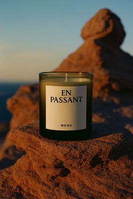 a candle sitting on top of a rock
