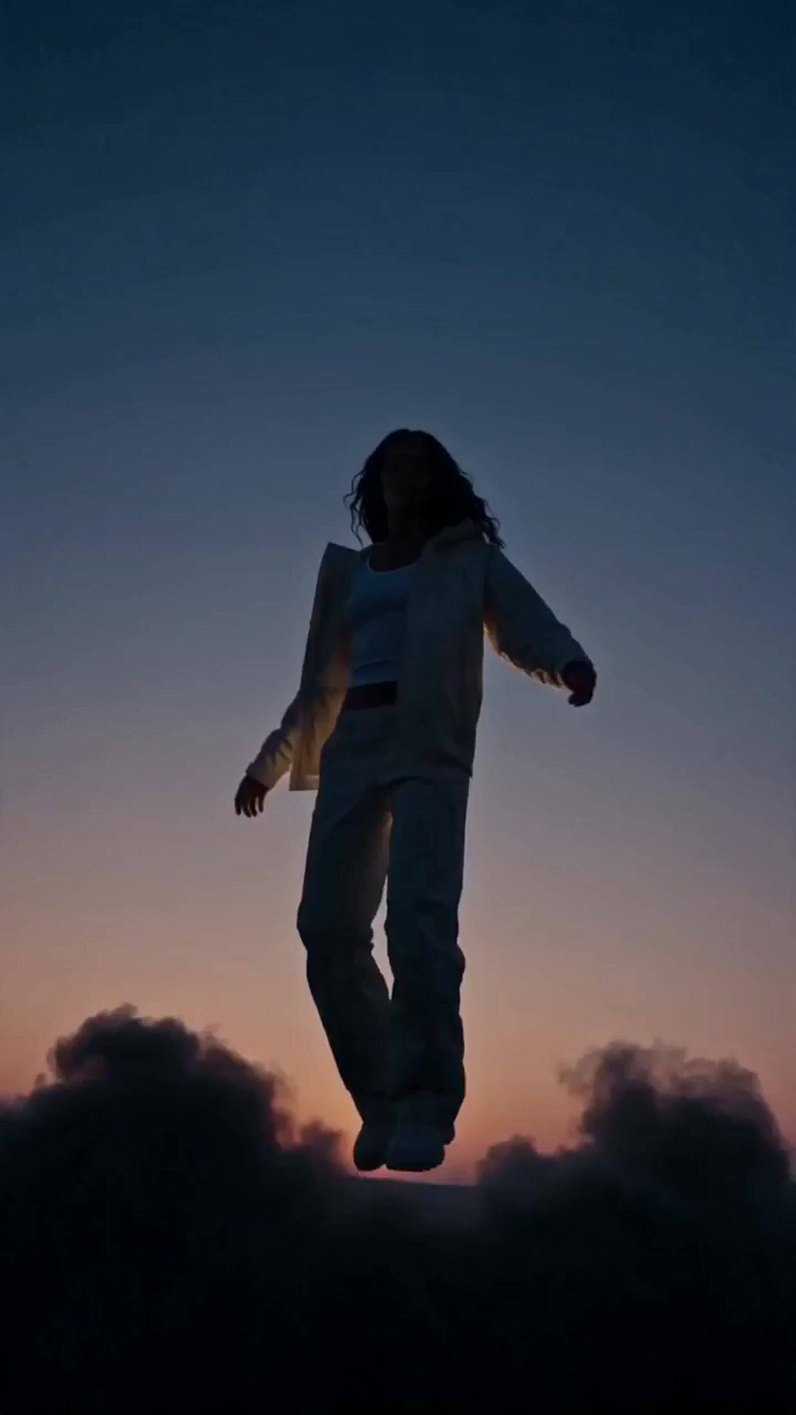 a person jumping in the air on a skateboard