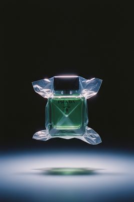 a bottle of perfume sitting on top of a table