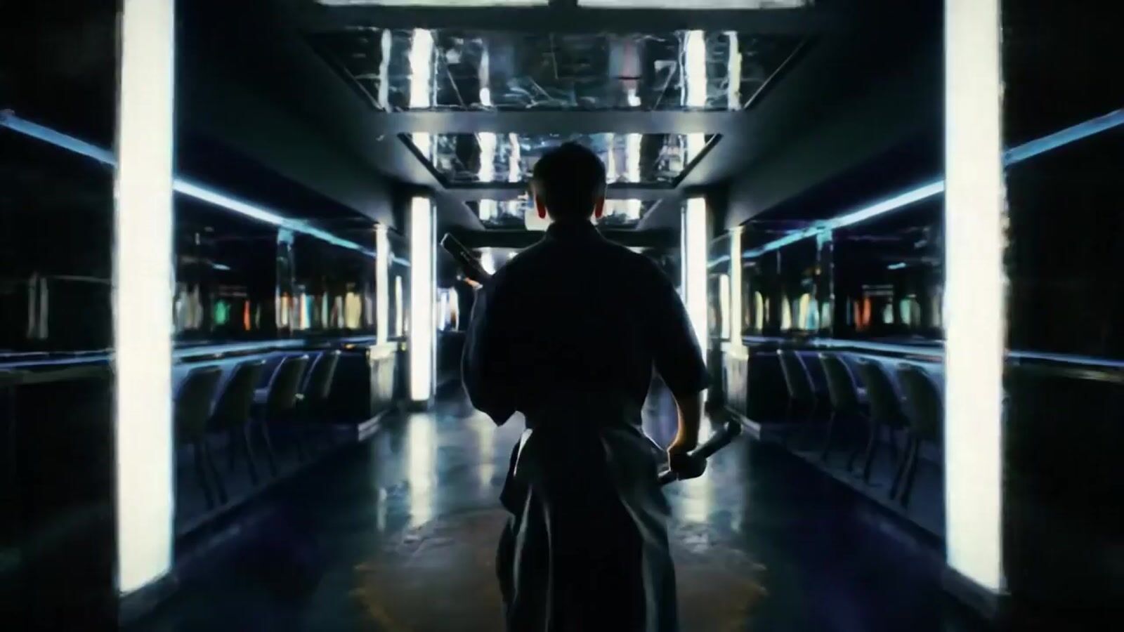a man walking down a hallway in a building