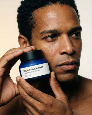 a man is holding a jar of hydration