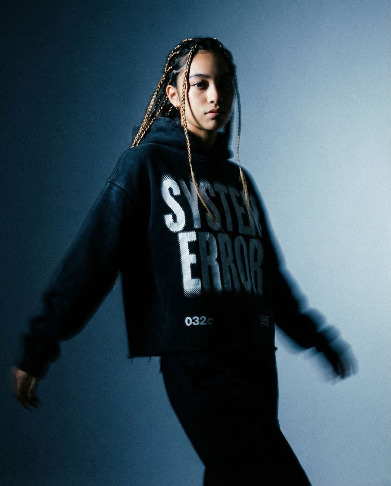 a woman with dreadlocks is posing for a picture