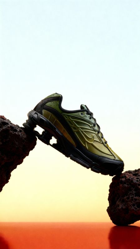 a pair of shoes on top of a rock