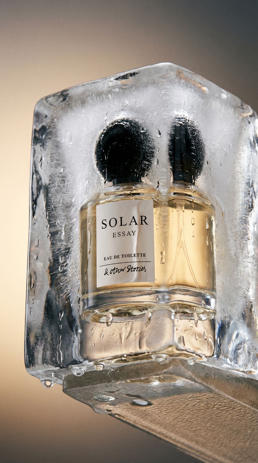 a couple of bottles of perfume sitting on top of a shelf