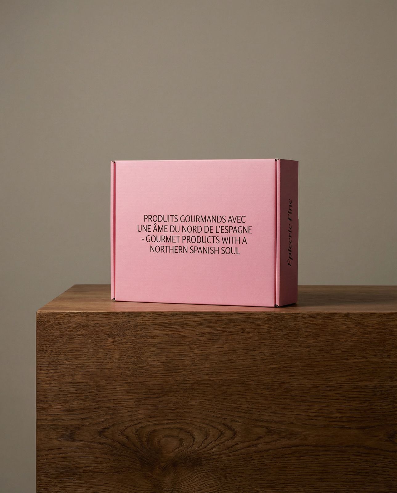 a pink book sitting on top of a wooden table
