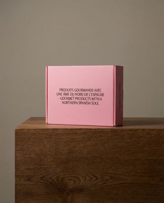 a pink book sitting on top of a wooden table