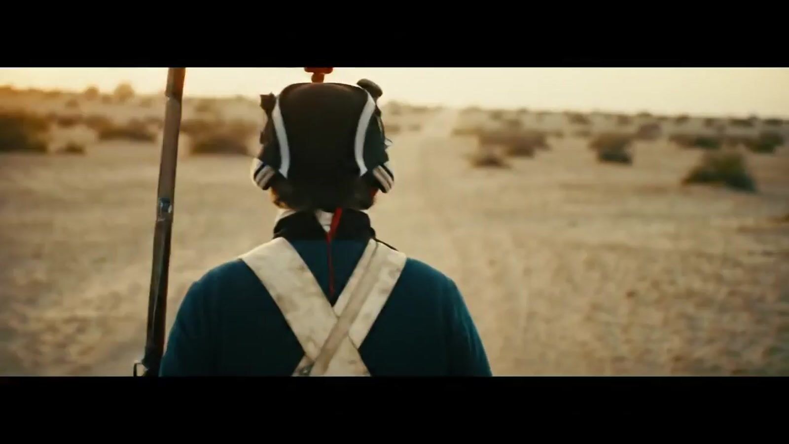 a person with a back pack on a dirt road