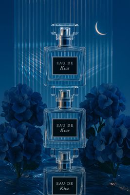 three perfume bottles are stacked on top of each other